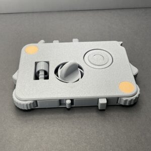 Gray 3D-printed fidget board with tactile controls
